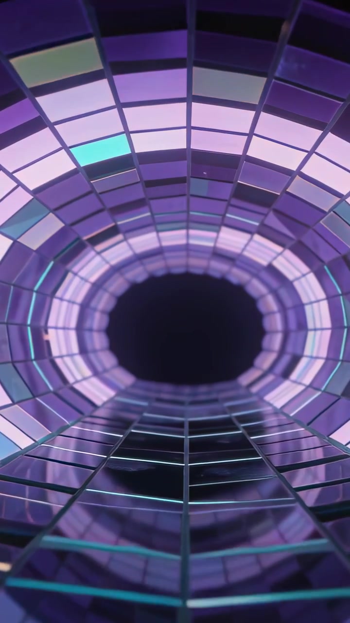 Video vertical: Reproducción de cámara moviéndose hacia el vacío en un túnel, revelando barras de escalera y anillos LED