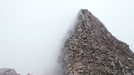 Drone-shot-of-Marble-Peak-covered-by-clouds,-heavenly-feeling-Nepal,-Stone-factory-4K