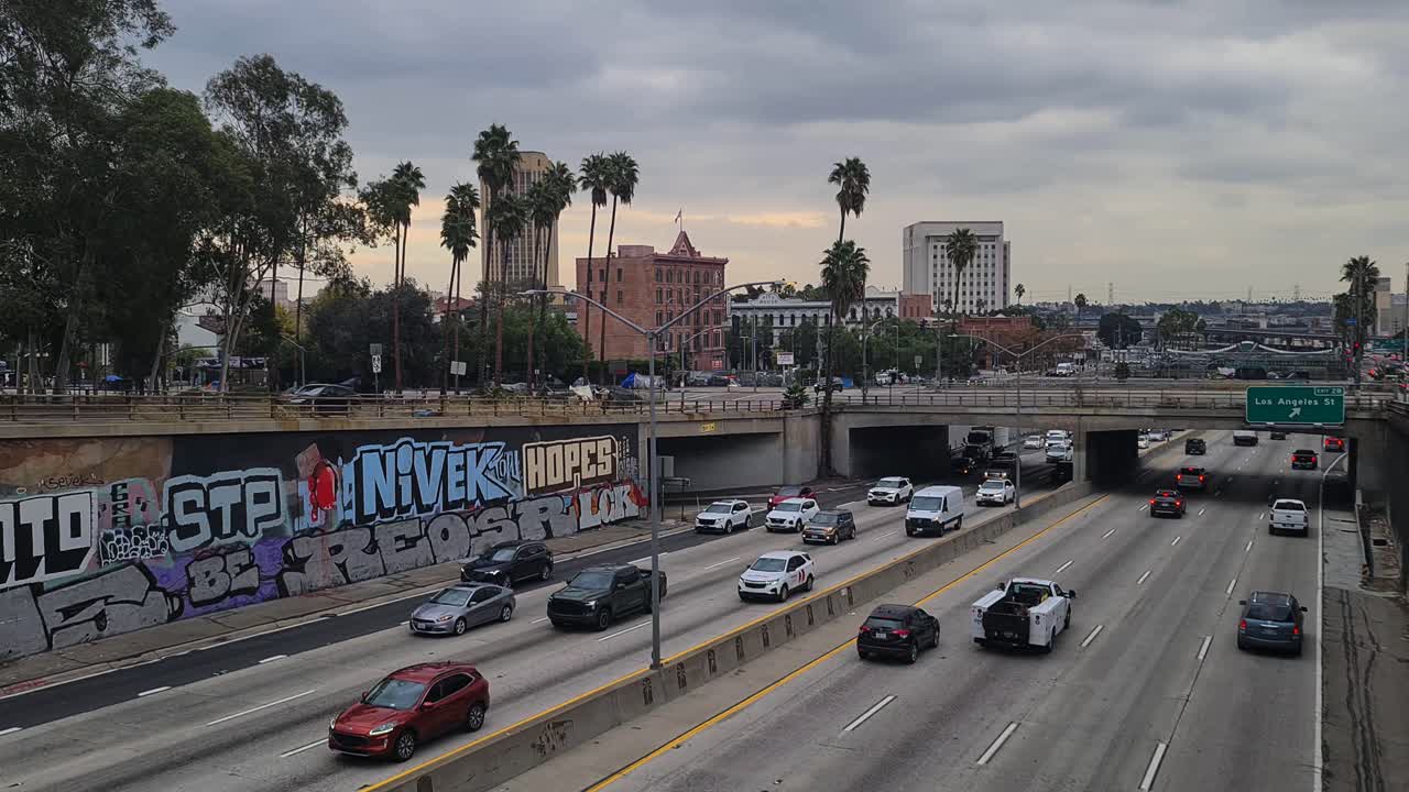 Traffic on a Los Angeles Highway with Urban Background and Graffiti
