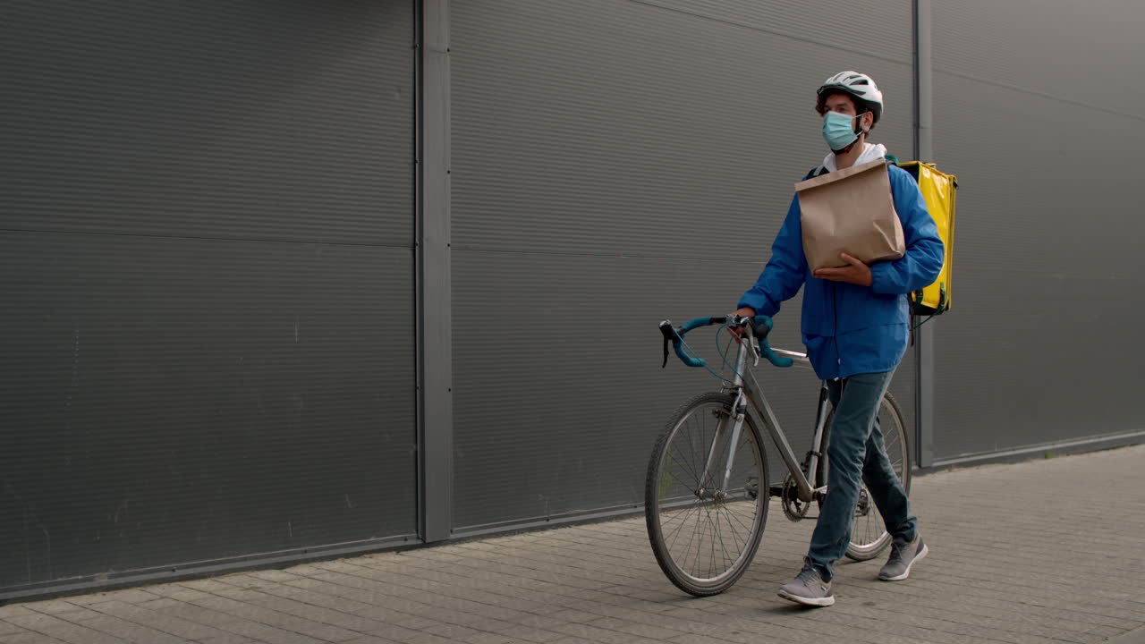 Delivery Person on Bike with Mask