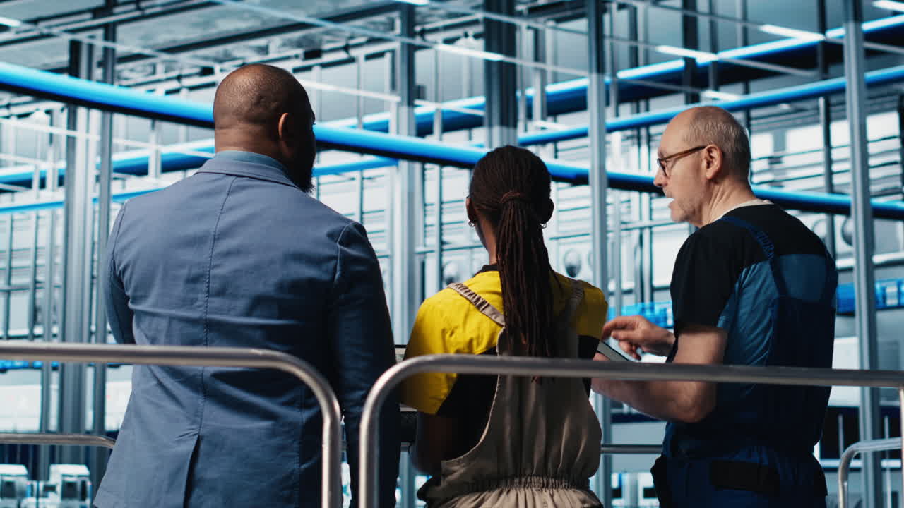 Manager on industrial platform overseeing industry 4.0 photovoltaics plant