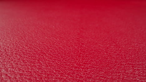 texture of cow leather surface colored red as background