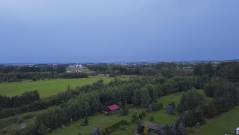 Aerial-Shot-of-a-Lightning-Strike-in-a-Distance-over-a-Countryside