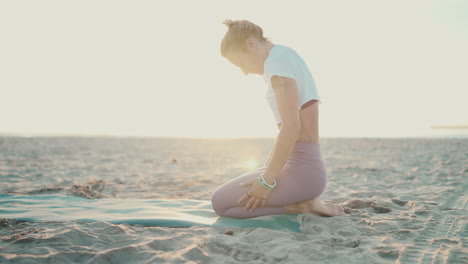 sportswoman doing yoga exercises outdoors.