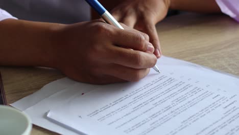 businessman hand signing contract letter with pen