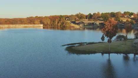 low altitude aerial view approach to lake marina club house