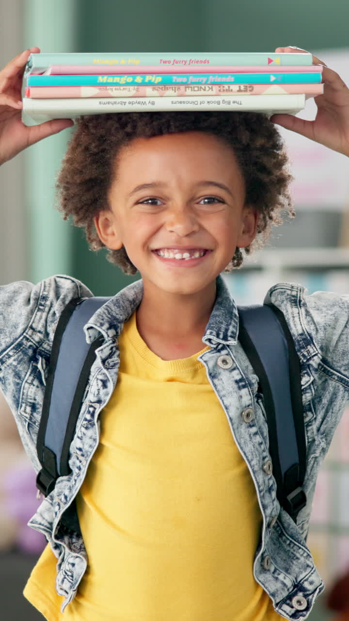 Happy student with books on head