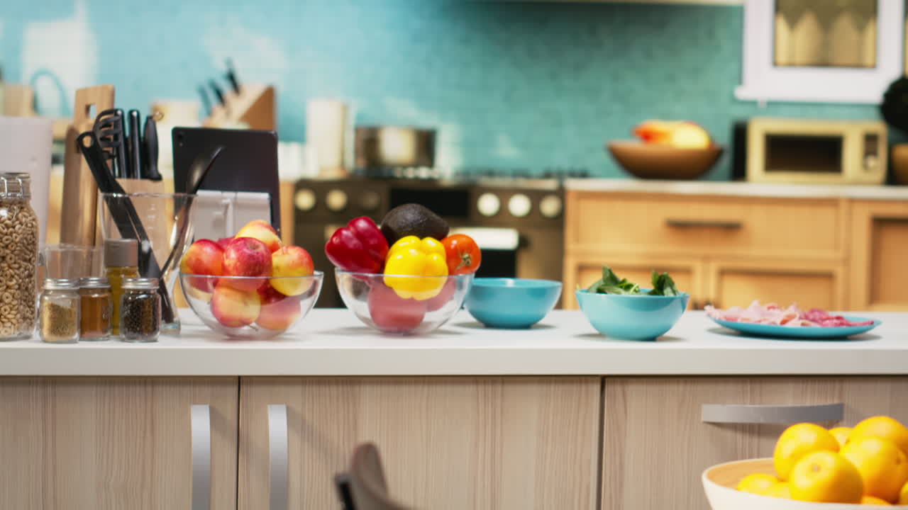 Empty cozy kitchen with a pizza prep area ready for cooking on the isle