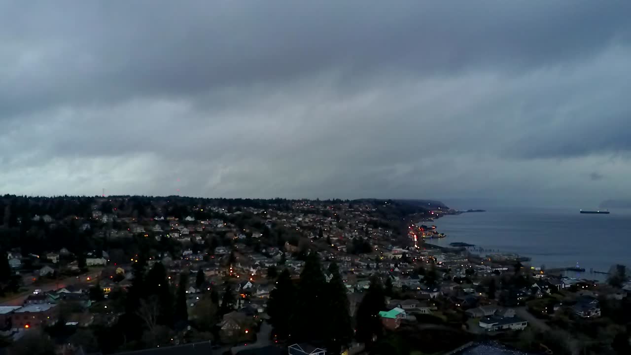 Thick Dark Clouds Over The Commencement Bay In Tacoma, Washington in Stormy Weather - Aerial Shot