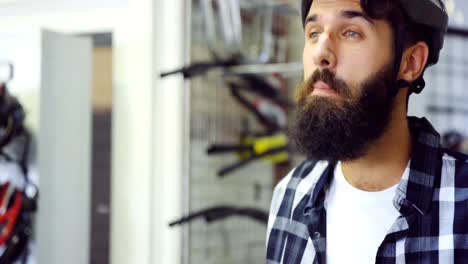 Mechanic-wearing-a-helmet-in-workshop