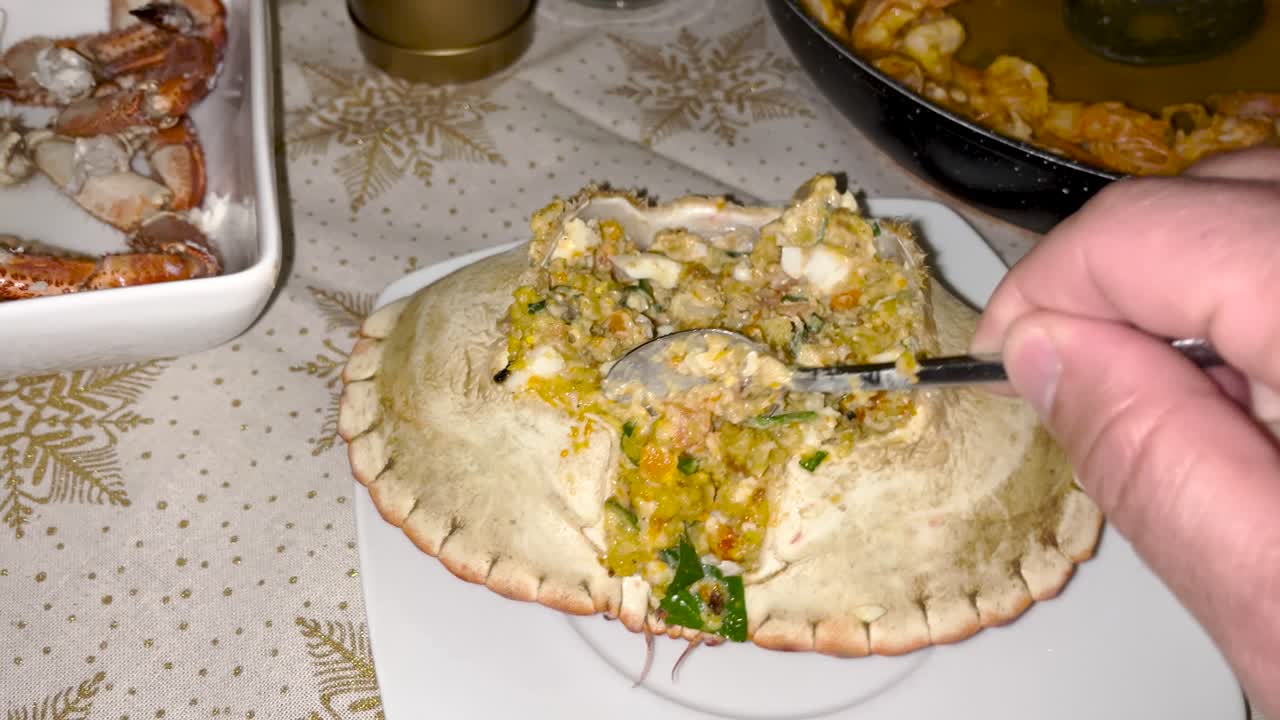 A delicious serving of Portuguese stuffed crab, with crab meat, herbs, and spices filling the shell, offering a savory and flavorful seafood experience. Perfect for seafood lovers and gourmet dining.