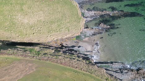 Bird-eye-at-the-entrance-of-The-Secret-Waterfall-in-Donegal---4K-Cinematic-Drone-Footage---Co