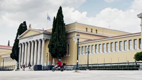iconic zappeion hall building in athens under a cloudy sky