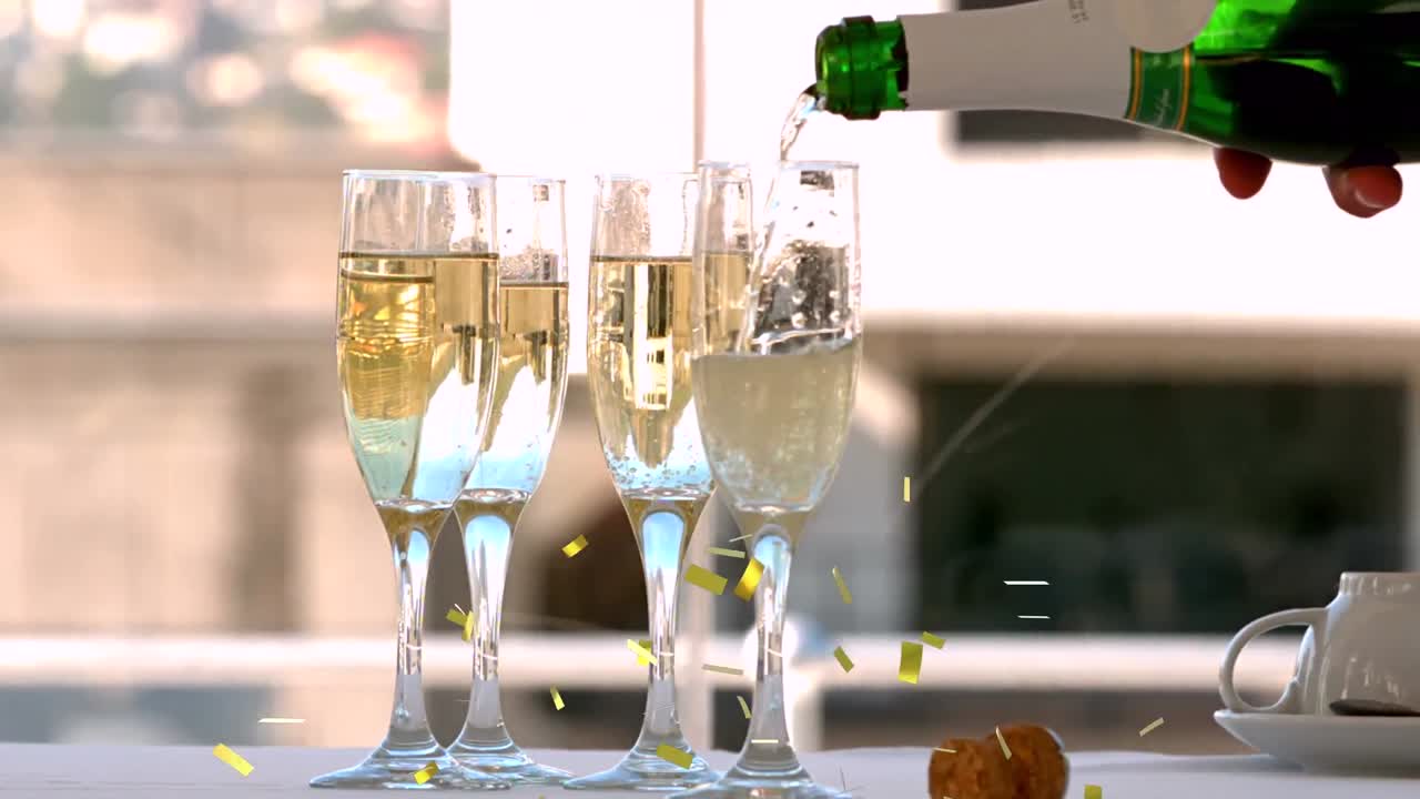 Animazione di coriandoli che cadono e champagne che viene versato nei flûte