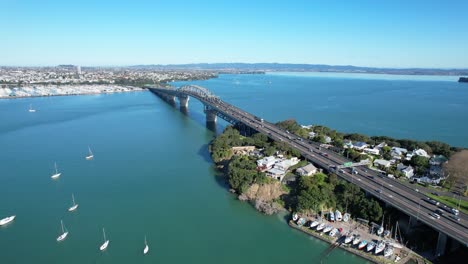 Harbour-Bridge-With-City-In-Background-In-Auckland,-New-Zealand---Aerial-Drone-Shot