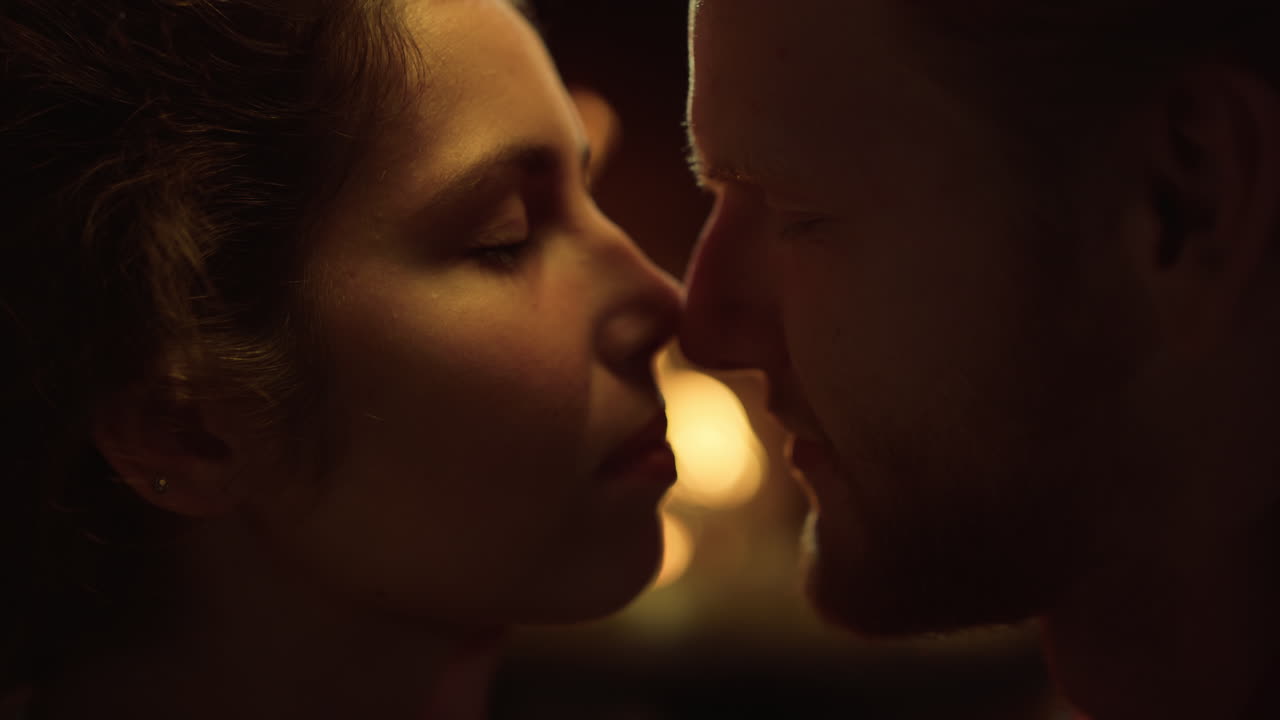 Sexy couple touch noses together. Tender lovers faces express feelings on date.