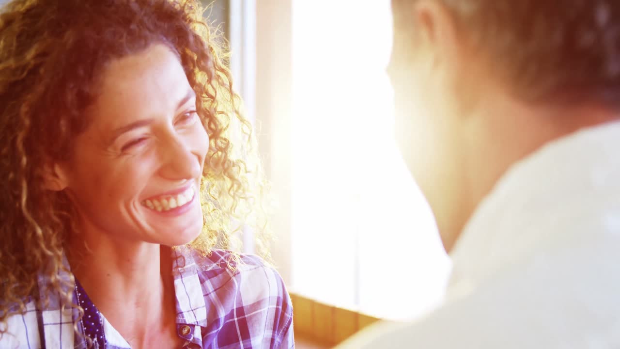 Couple interacting with each other in supermarket