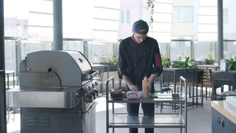 chef grilling burgers on outdoor grill