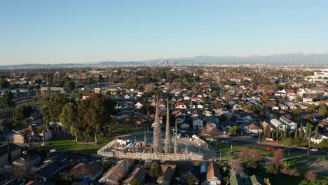 Wide-push-in-aerial-shot-of-the-Watts-Towers-in-Los-Angeles,-California