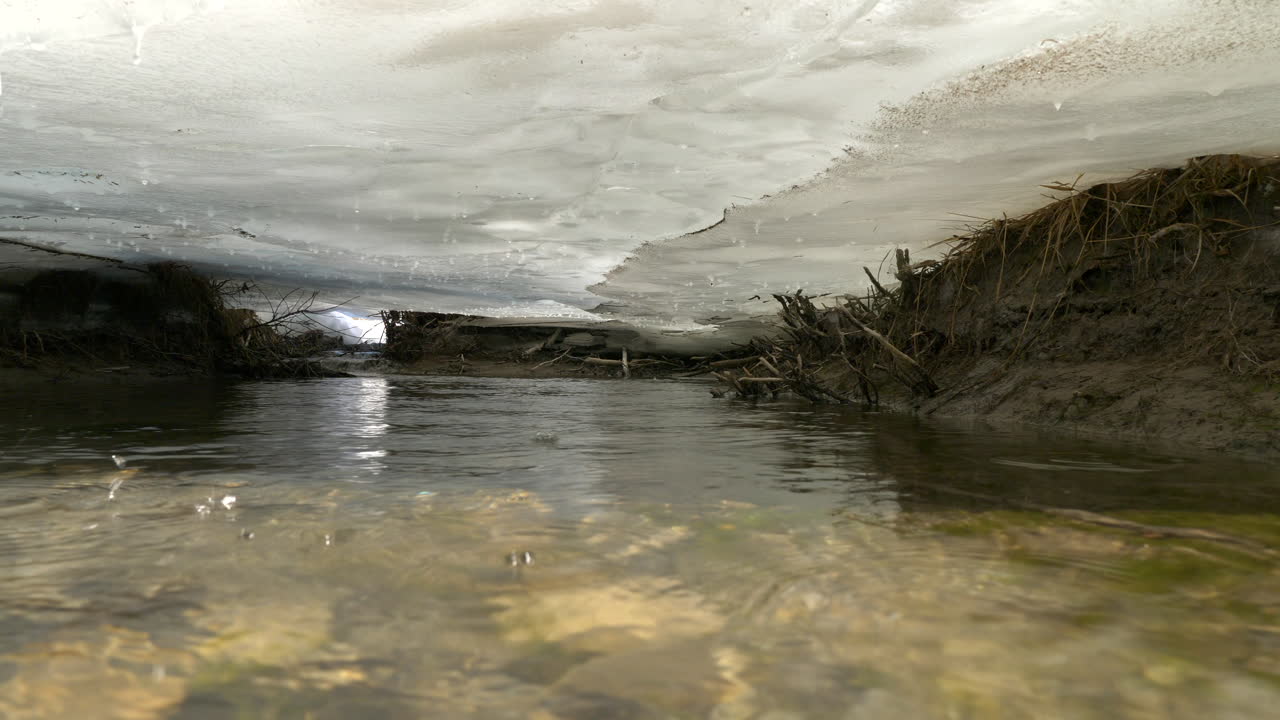Melting ice shelf while water runs underneath it.