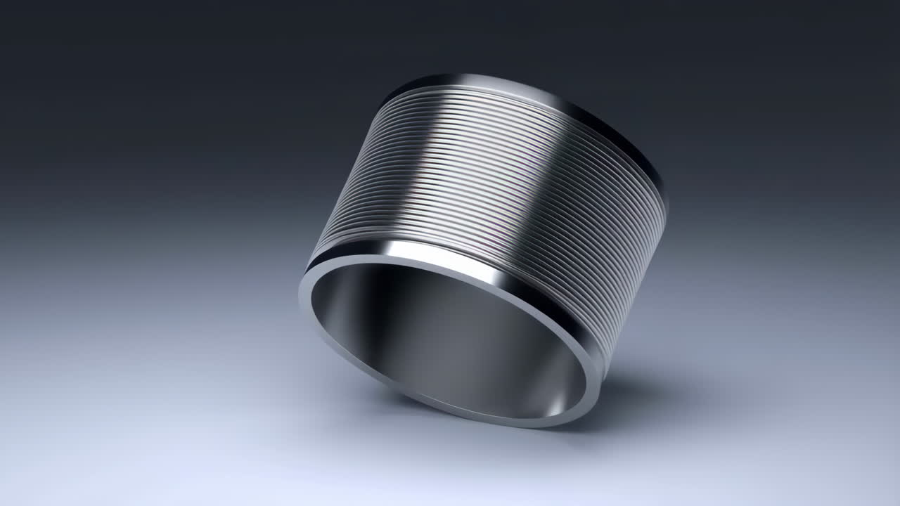 A shiny metallic cylindrical object with horizontal grooves