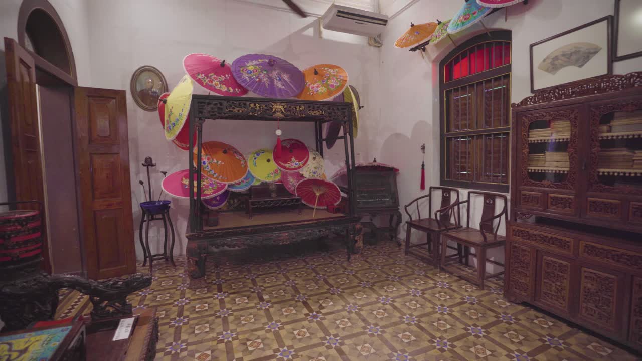 Pan Right of Asian Artefacts and Artwork Within Peranakan Museum Room