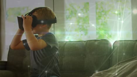 animation of network of connections over caucasian boy wearing vr headset