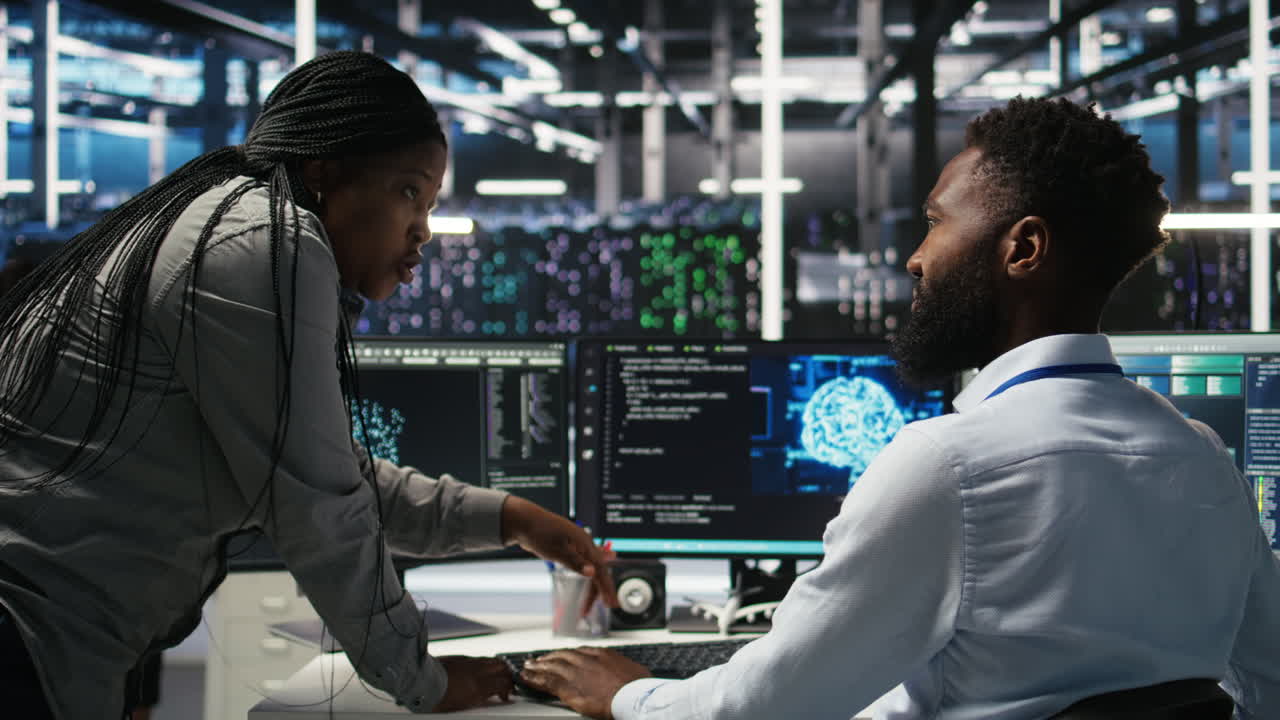 Data center supervisor overseeing work done by engineer using deep learning