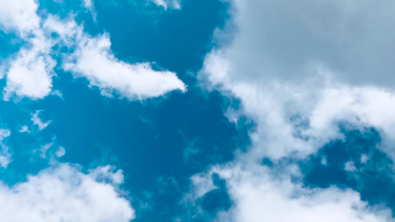 Time Lapse of White and Grey Clouds Moving Across a Blue Sky
