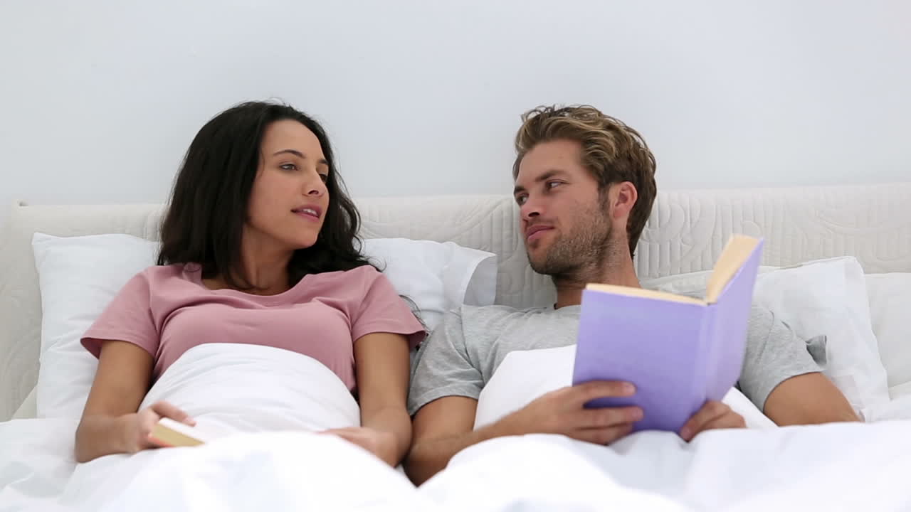 Couple talking about the books they are reading