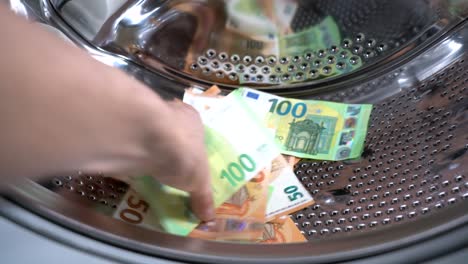 money hanging to dry with clothespin - euro money banknotes after  washing machine - illegal cash 50, 100 €  and mafia money laundering - increase in the cost of living, energy and gas