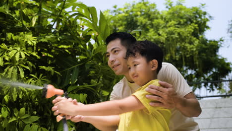 asian man and boy in the backyard