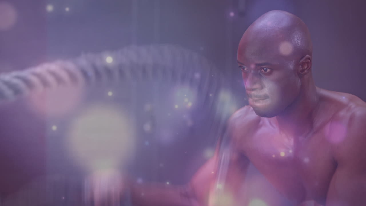 animación de luz brillante sobre un hombre en forma haciendo ejercicio en el gimnasio