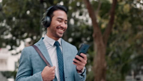 Headphones,-phone-and-businessman-walking