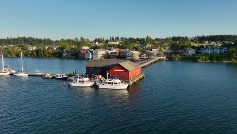 drone shot of the coupeville wharf extending from the city's historic downtown