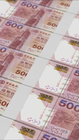video vertical de billetes de 500 dólares de hong kong impresos por una prensa de dinero