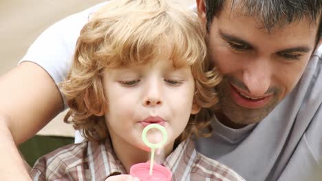 father with his son in the garden