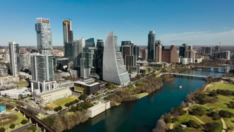 aerial shot of downtown austin, tx with the colorado river in frame