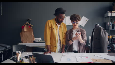 fashion designers collaborating on designs