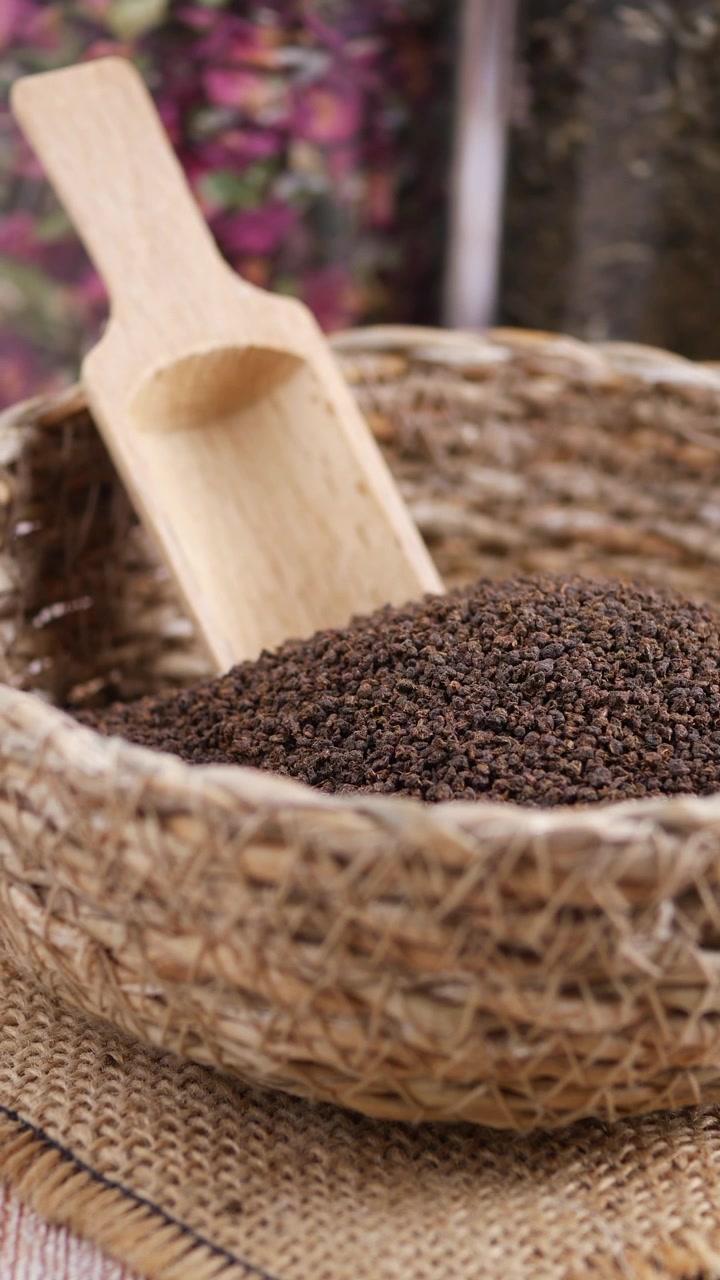 Close-up of Dry Black Tea Granules in a Rustic Basket