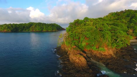 Forward-Strafe-Around-Rugged-Jungle-Island-Point-to-Reveal-Secret-Beach-Cove