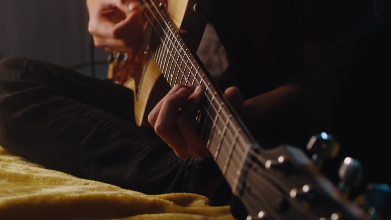 Person playing an electric guitar