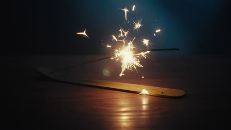a sparkler burn in the dark room