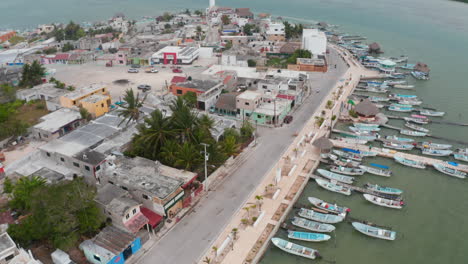 Aerial-view-of-rural-coastal-town-with-square.-Low-buildings-with-flat-roofs.-Rio-Lagartos,-Mexico.