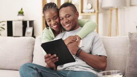 Video,-tablet-and-black-couple-with-hug