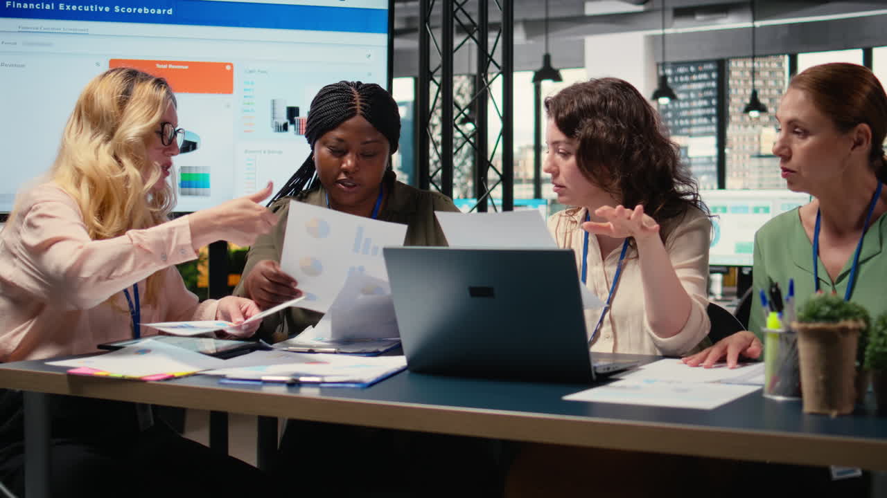 Vertical Video Team of career focused women aligning analytics and objectives