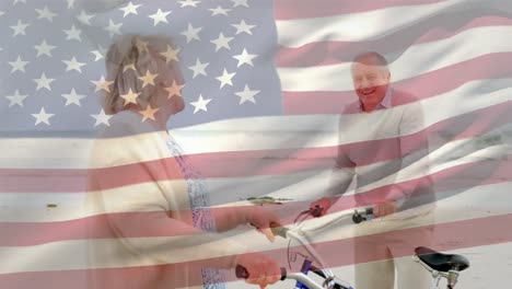 Animation-of-flag-of-america,-senior-caucasian-couple-with-bicycle-on-beach-looking-at-each-other