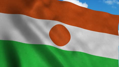 niger flag on a flagpole waving in the wind, blue sky background. 4k