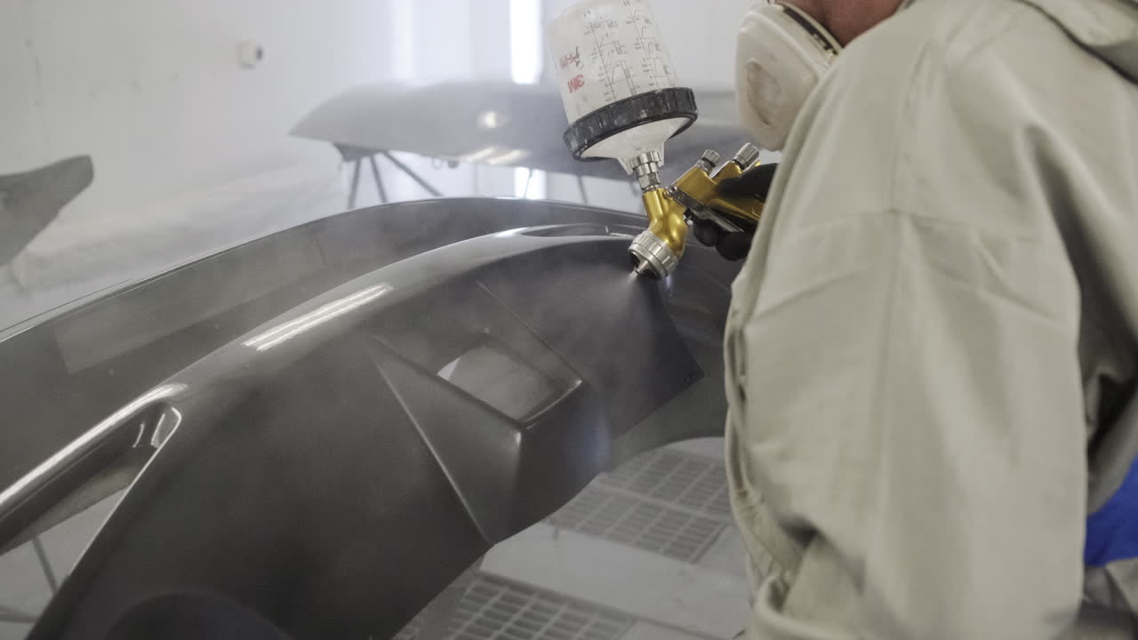 Car Bumper Painting in a Body Shop