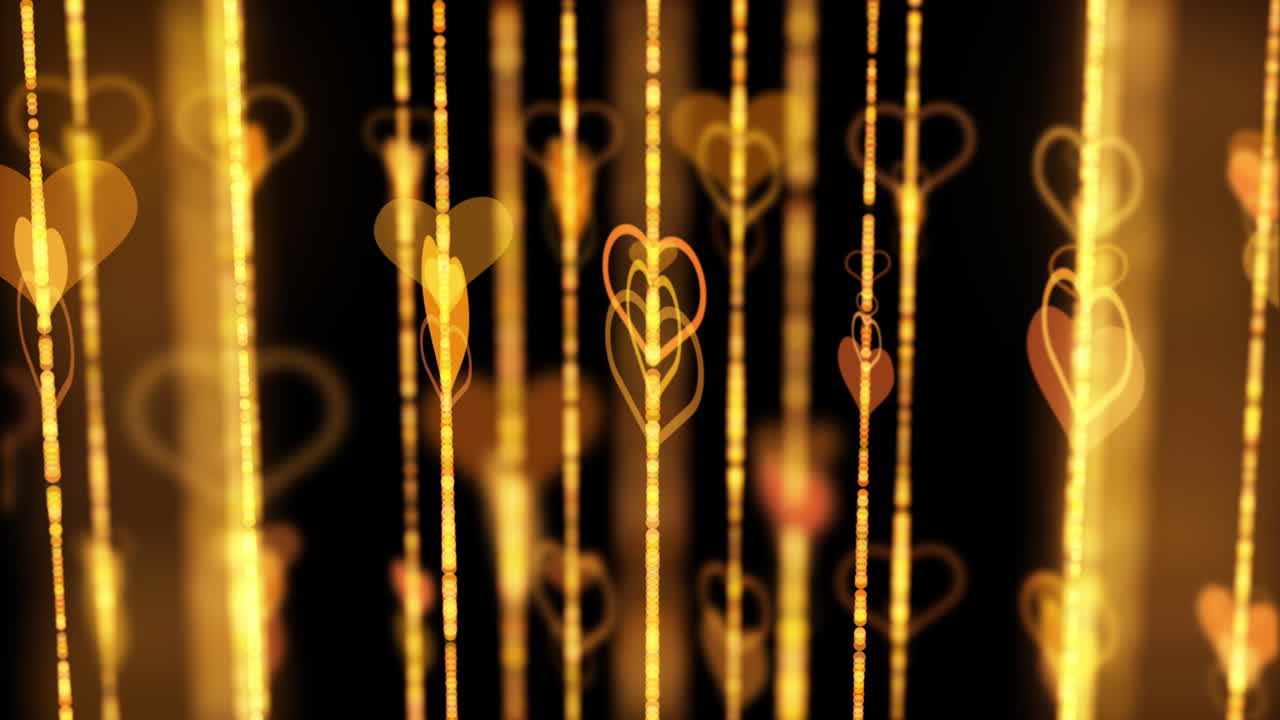 Golden hearts rotate on beads. Yellow vertical lines with blurry bokeh. Abstract animated background with moving elements.